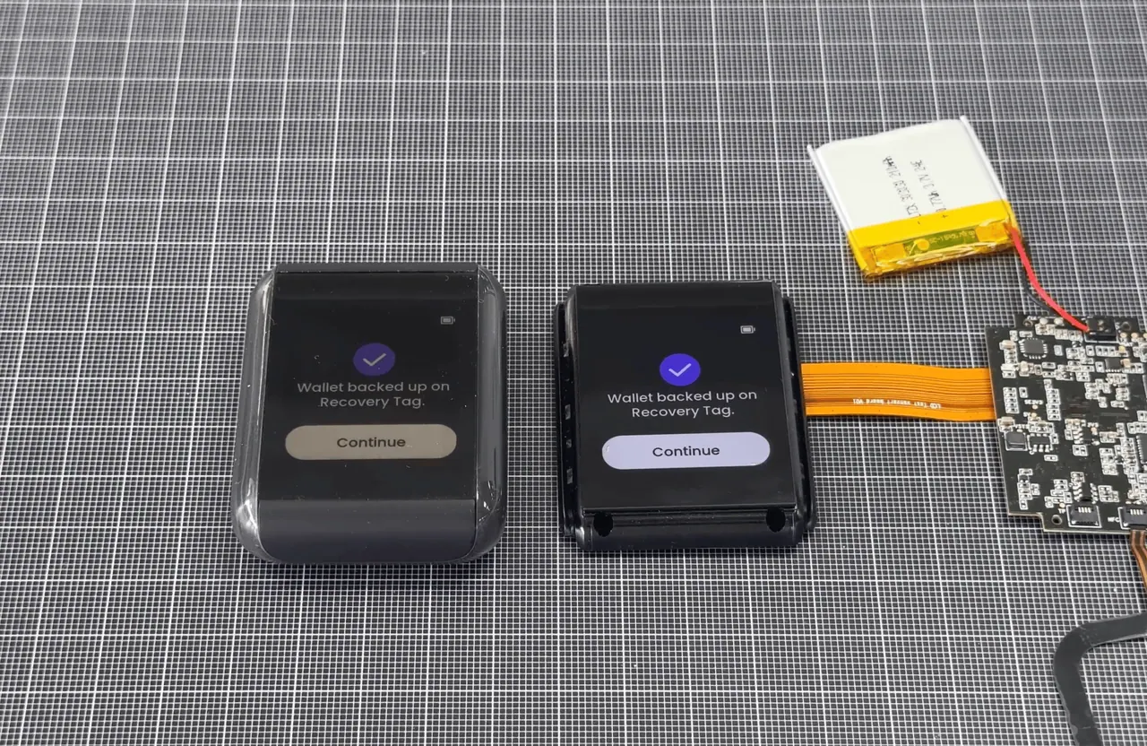 Early firmware running next to the bare board and battery.