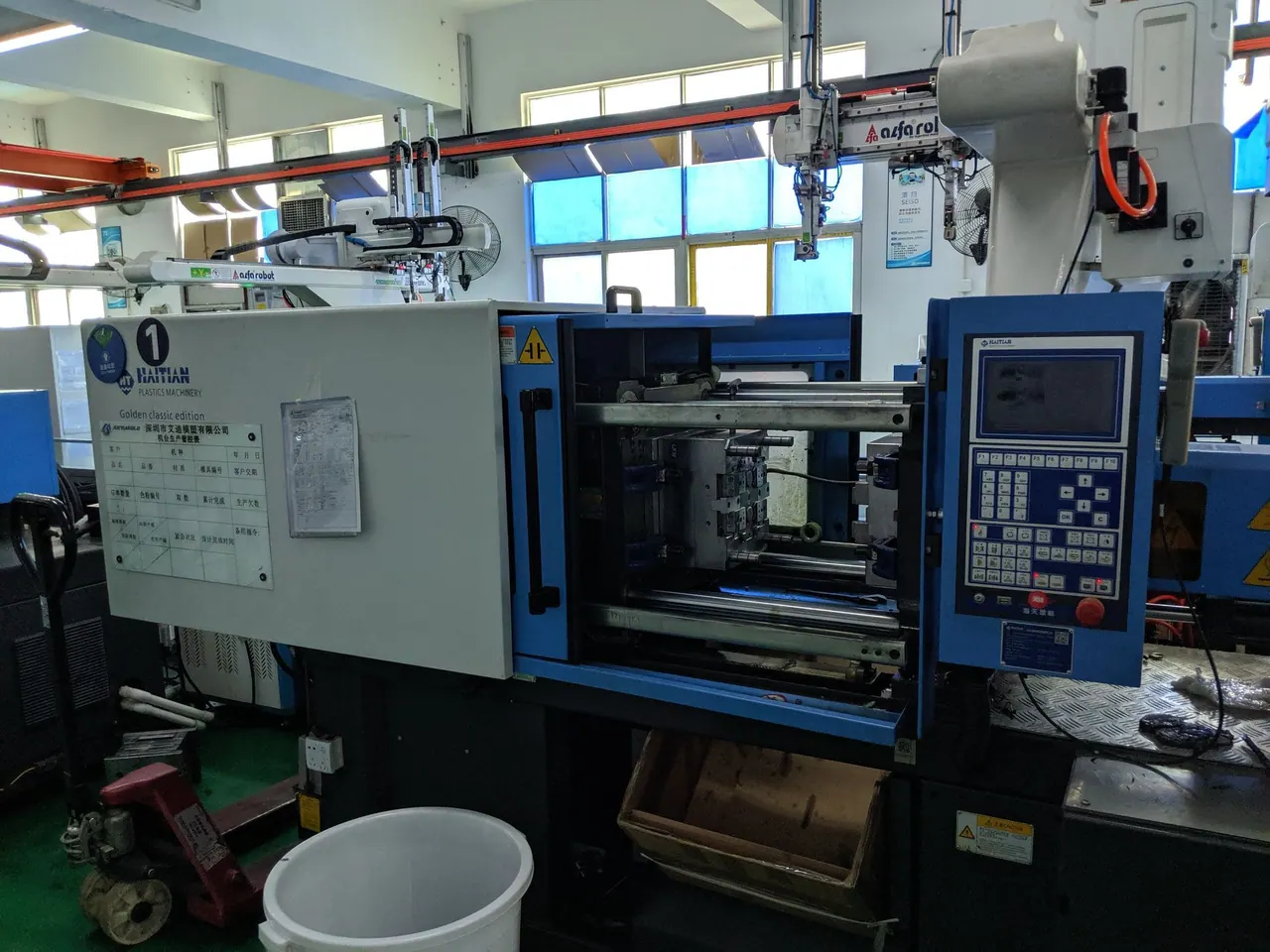 The mold goes into the injection machine.