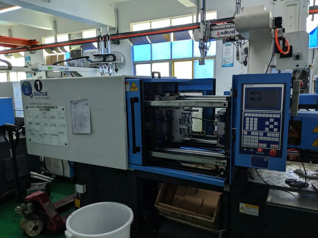 The mold goes into a large machine that will inject the plastic in it
